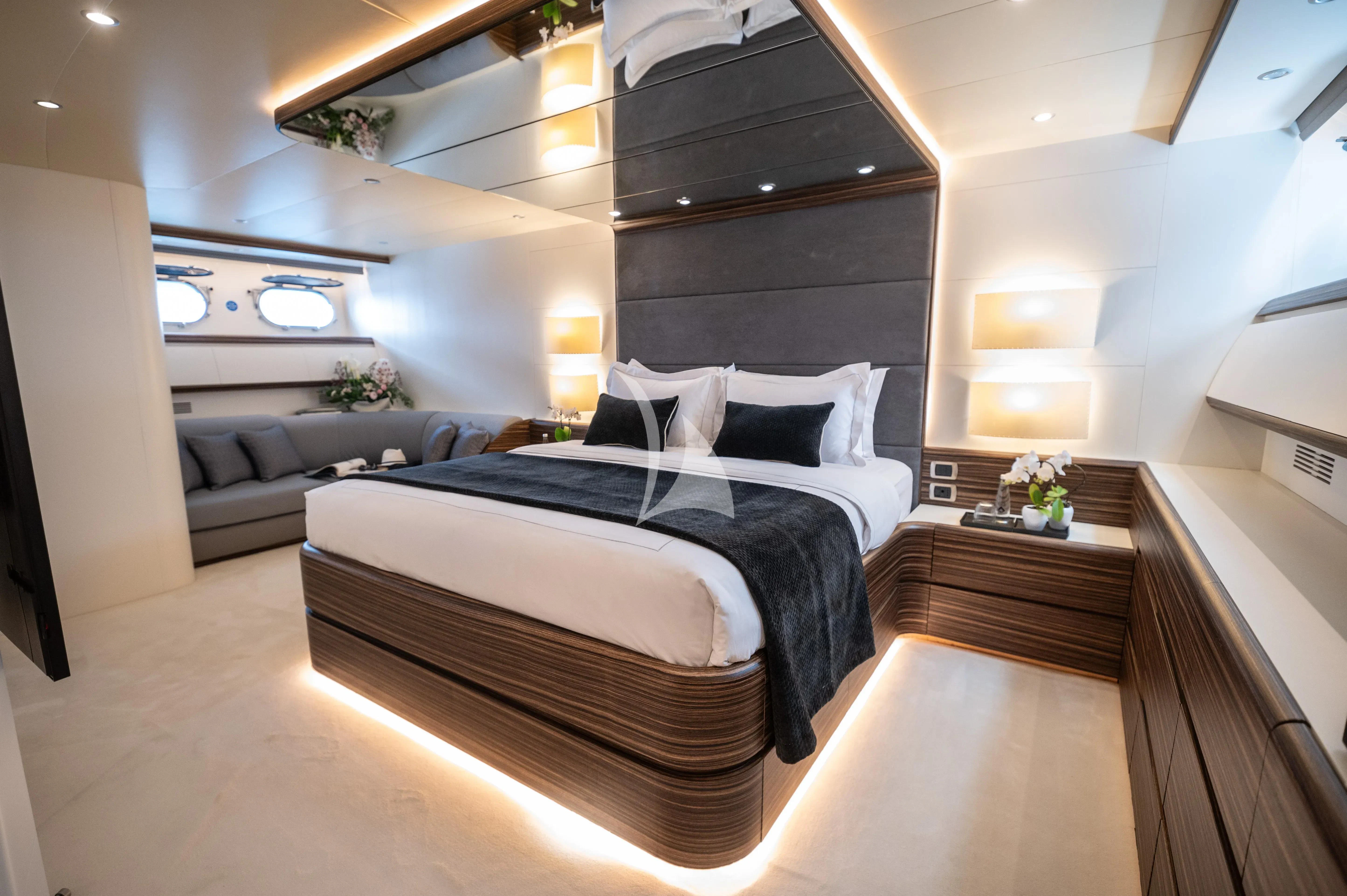a large bedroom with a large bed aboard PAREAKI II Yacht for Sale