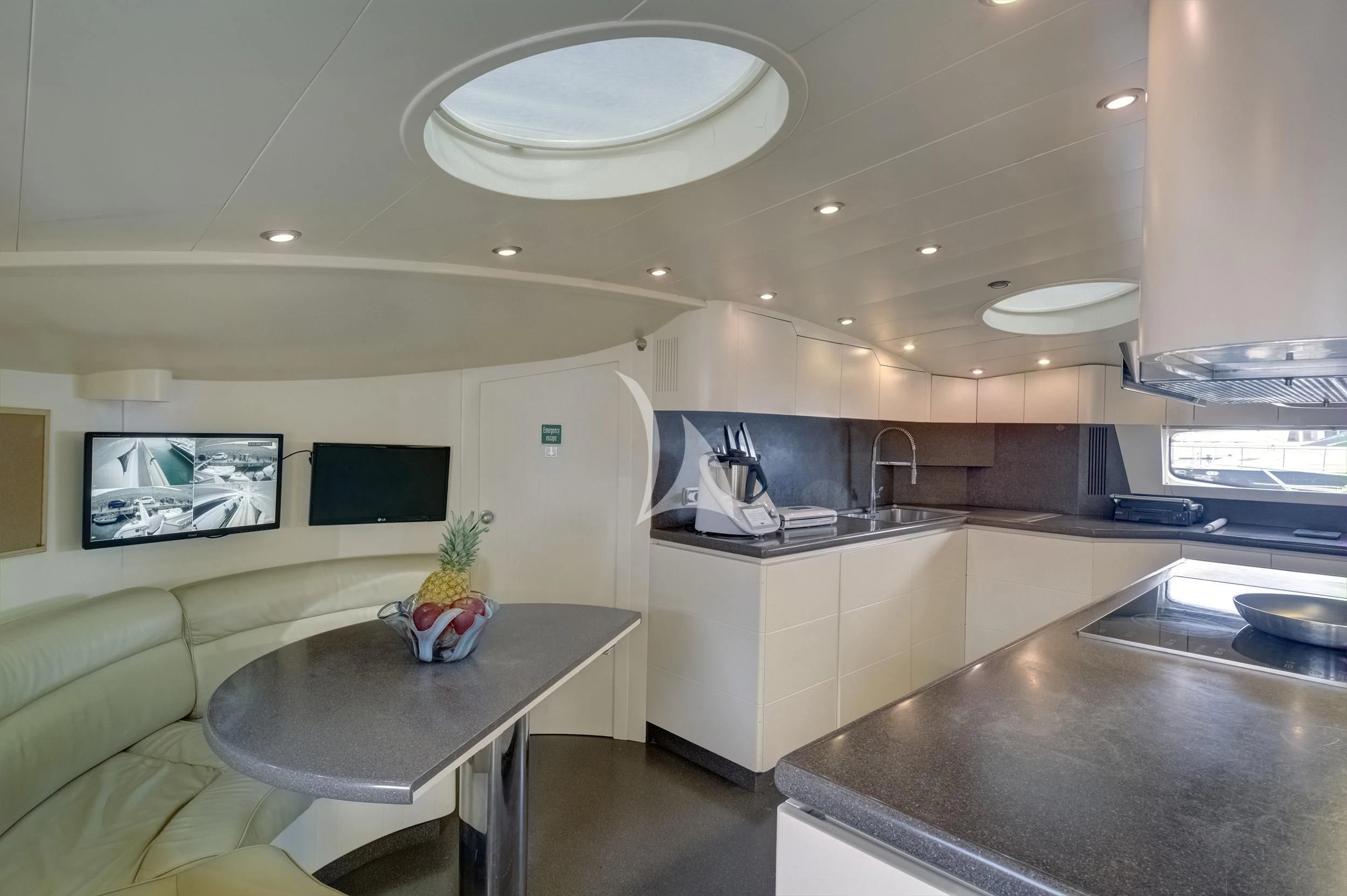 a kitchen with a large island aboard PAREAKI II Yacht for Sale