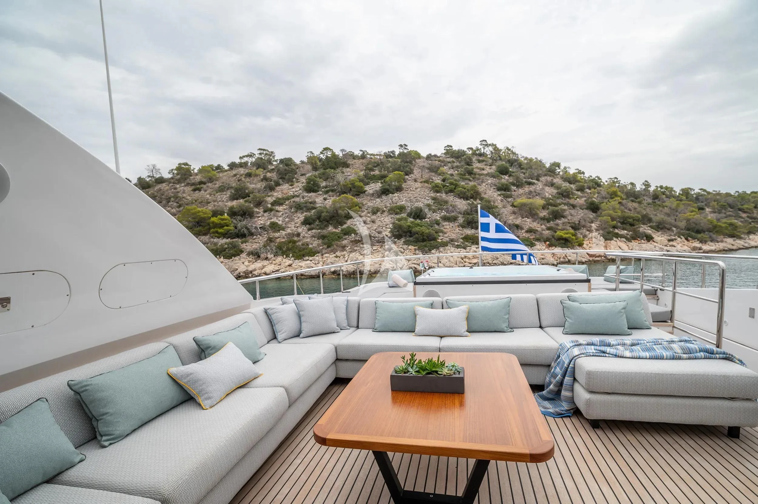 a room with a couch and a table with a table and chairs aboard PAREAKI II Yacht for Sale