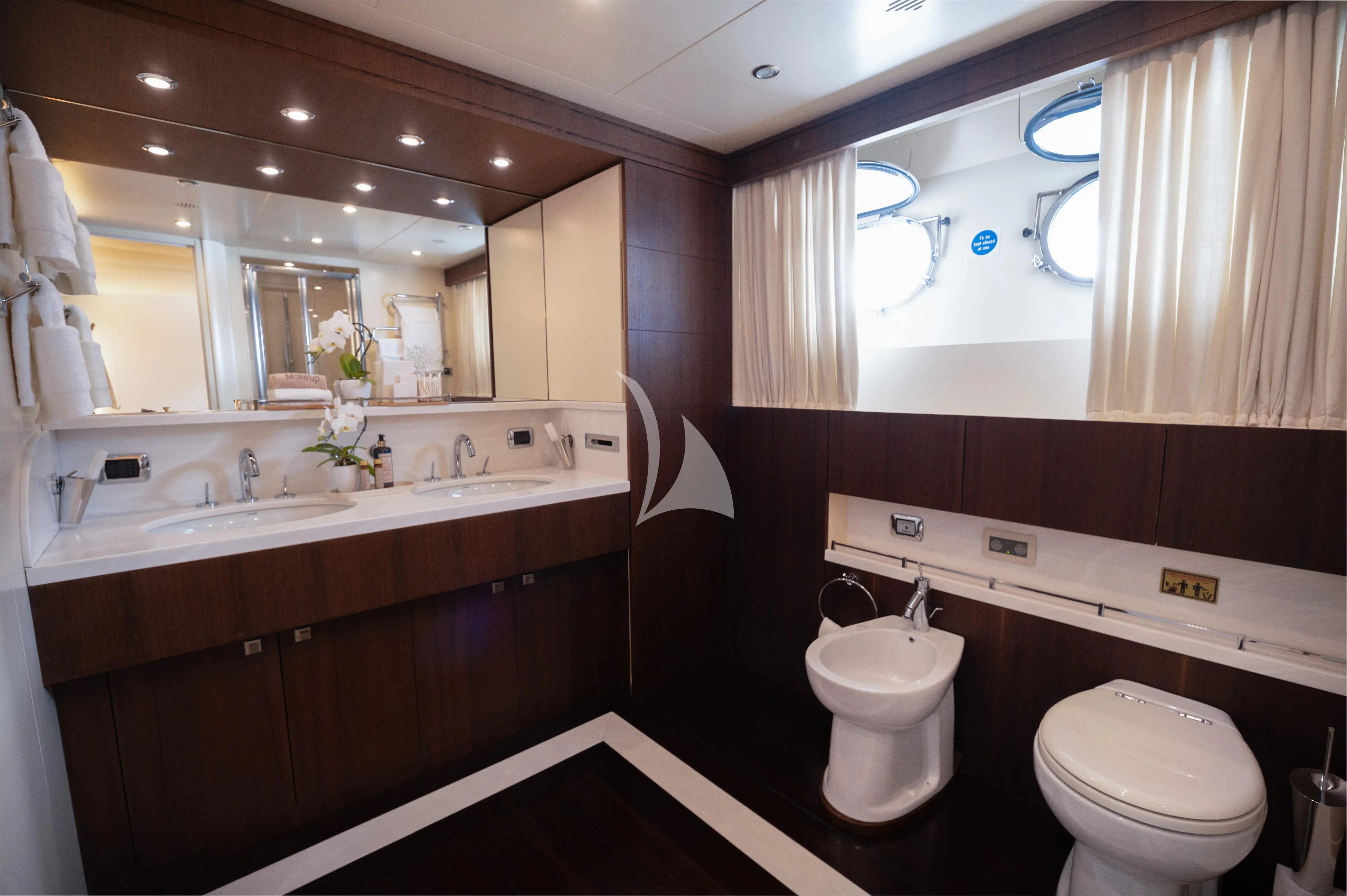 a bathroom with a sink and a toilet aboard PAREAKI II Yacht for Sale