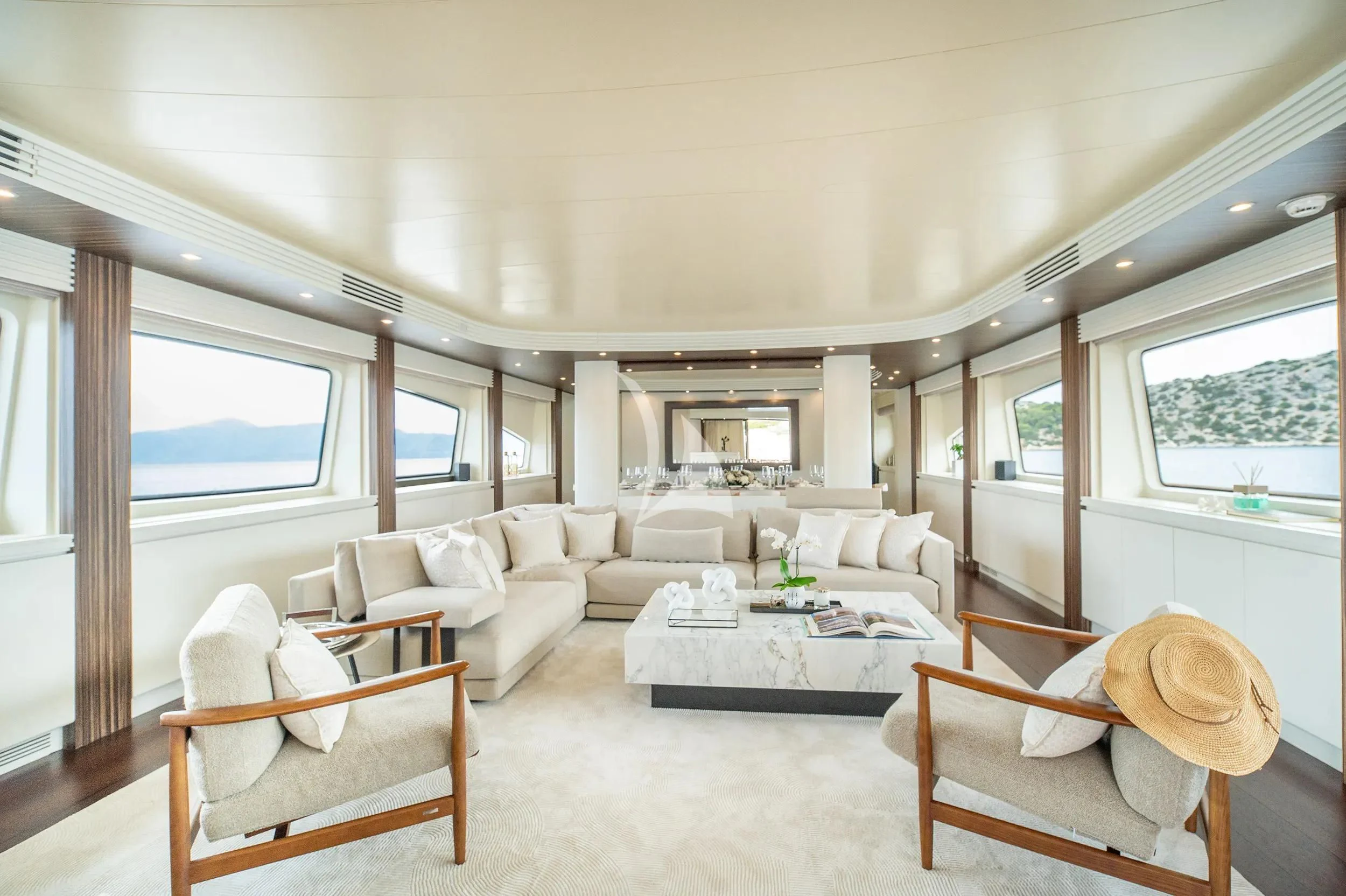 a living room with a large window aboard PAREAKI II Yacht for Sale