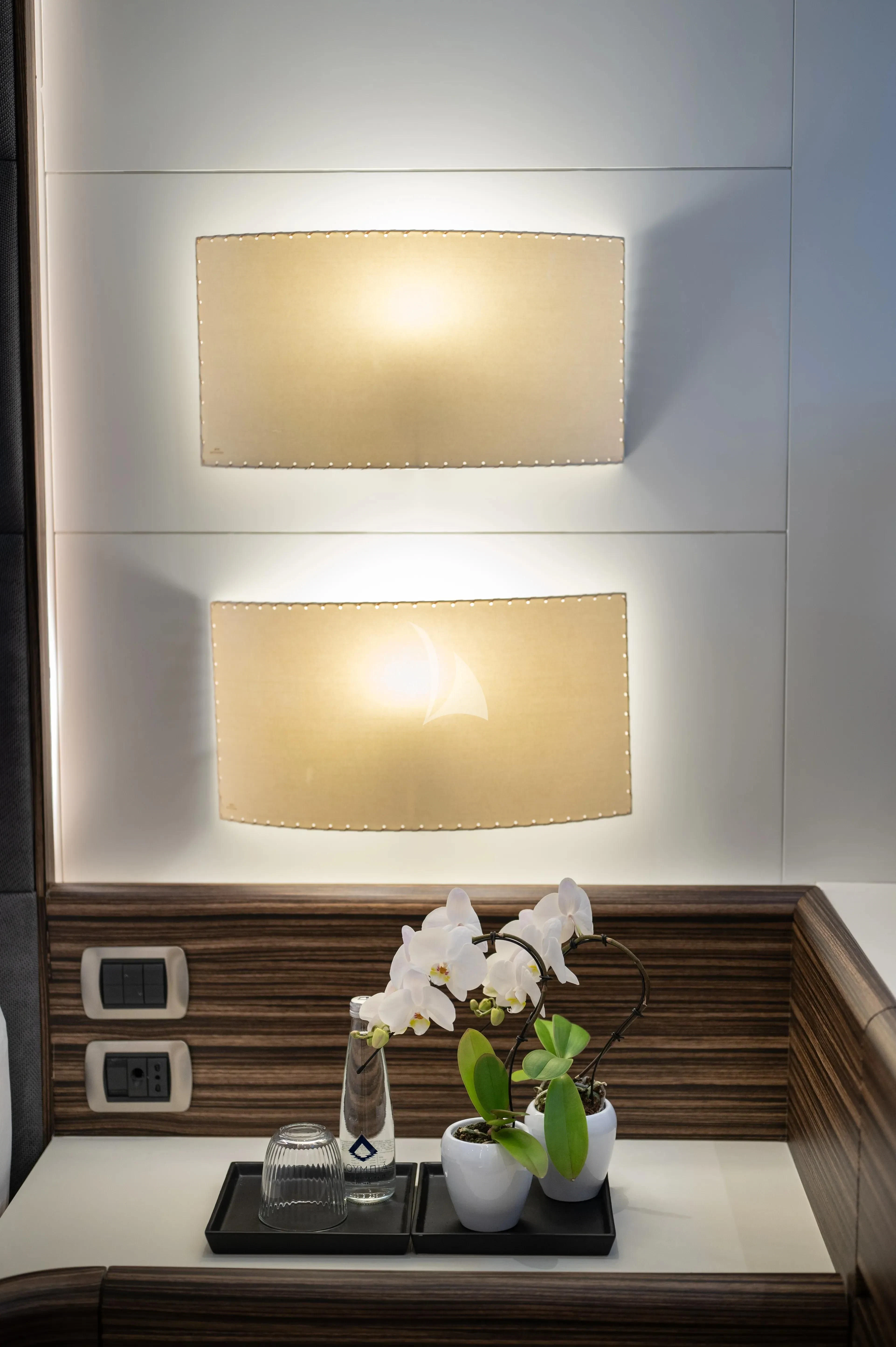 a white rectangular object on a black surface with white flowers aboard PAREAKI II Yacht for Sale