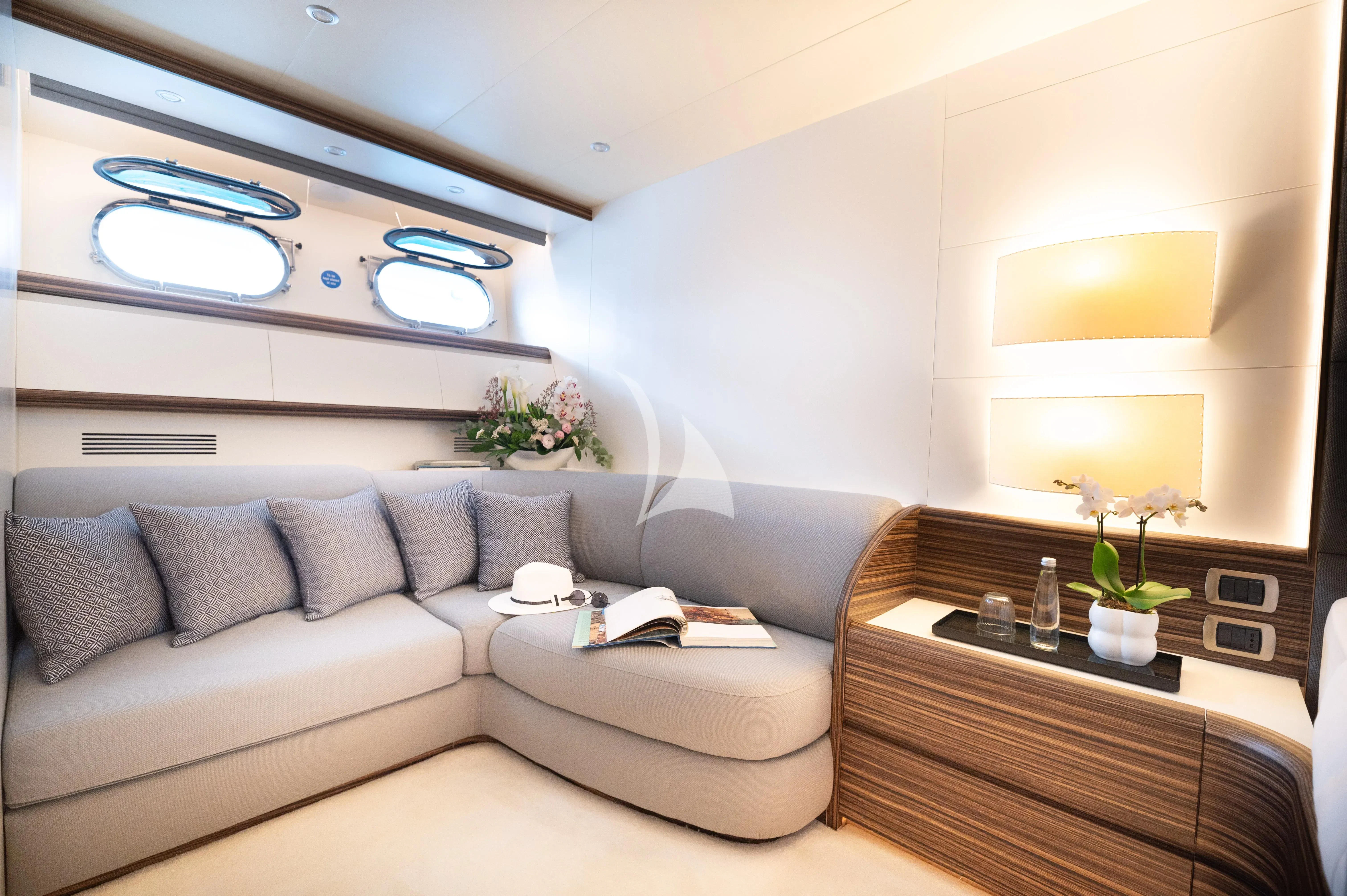 a living room with a couch and a coffee table aboard PAREAKI II Yacht for Sale