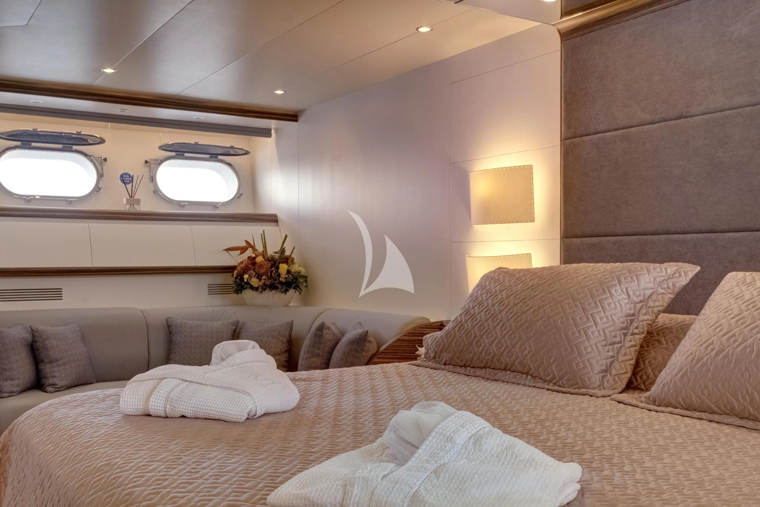 a bed with a couch and a television on it aboard PAREAKI II Yacht for Sale