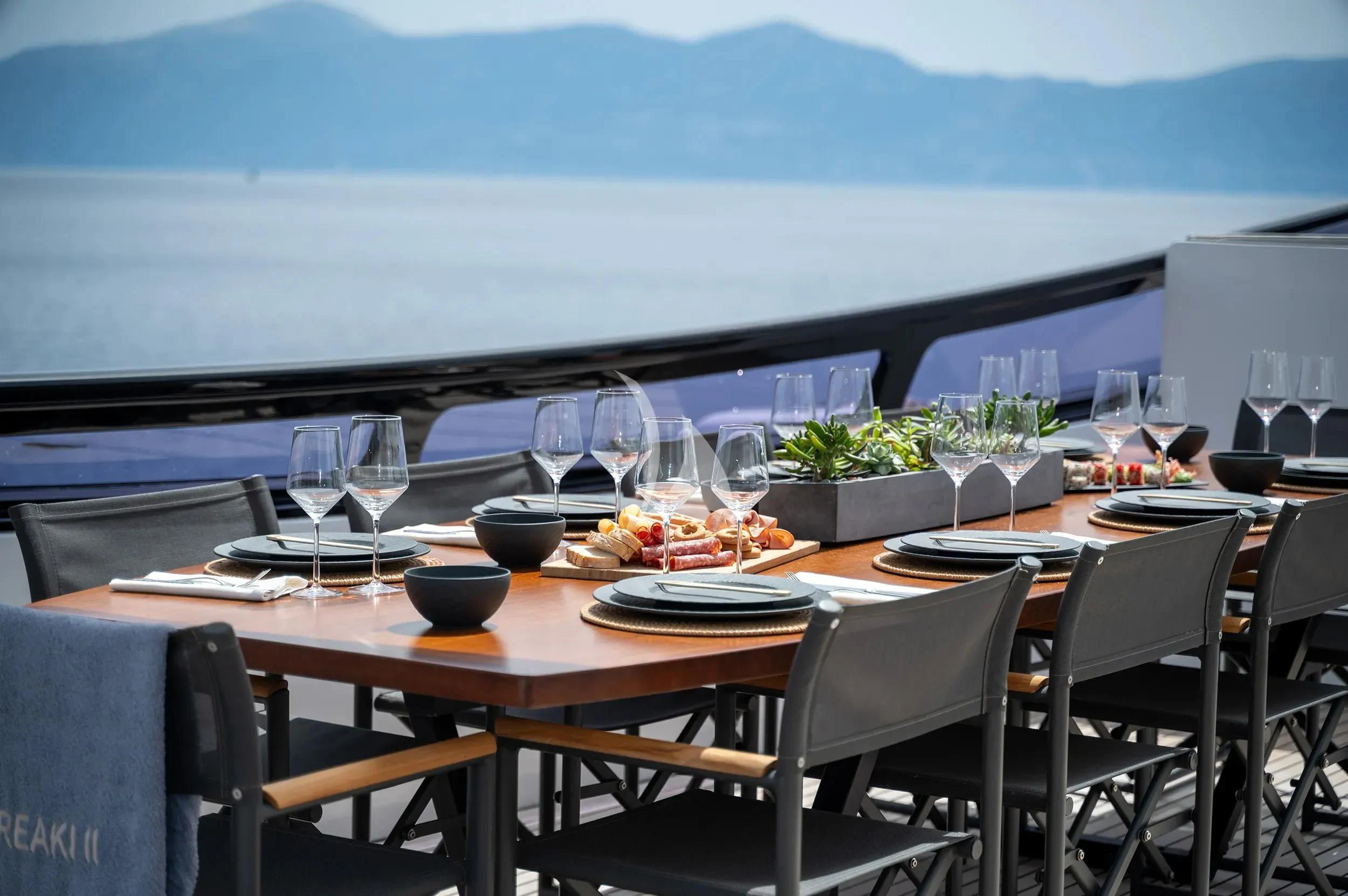 a table set for a meal aboard PAREAKI II Yacht for Sale
