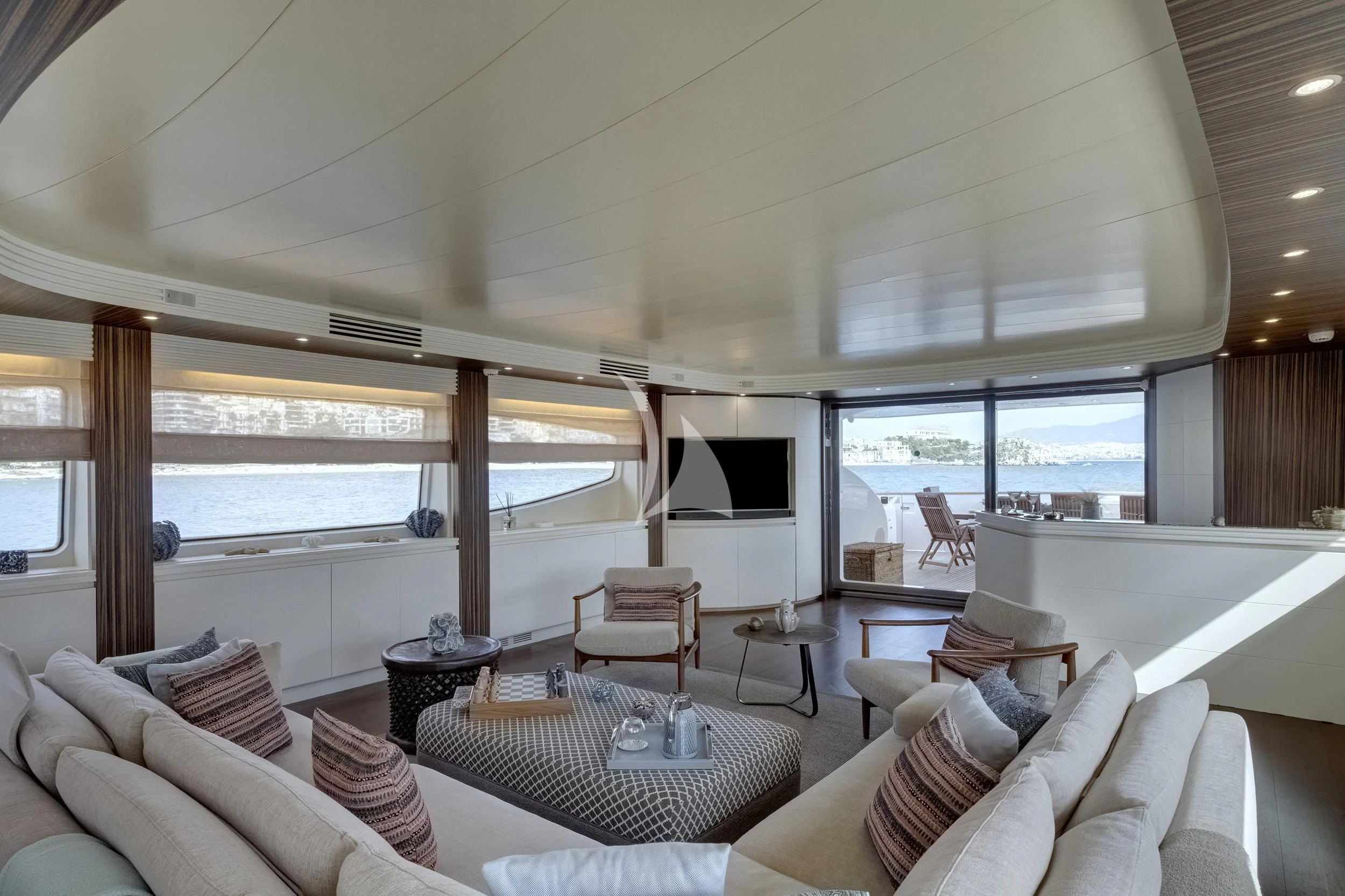 a living room with a large window aboard PAREAKI II Yacht for Sale