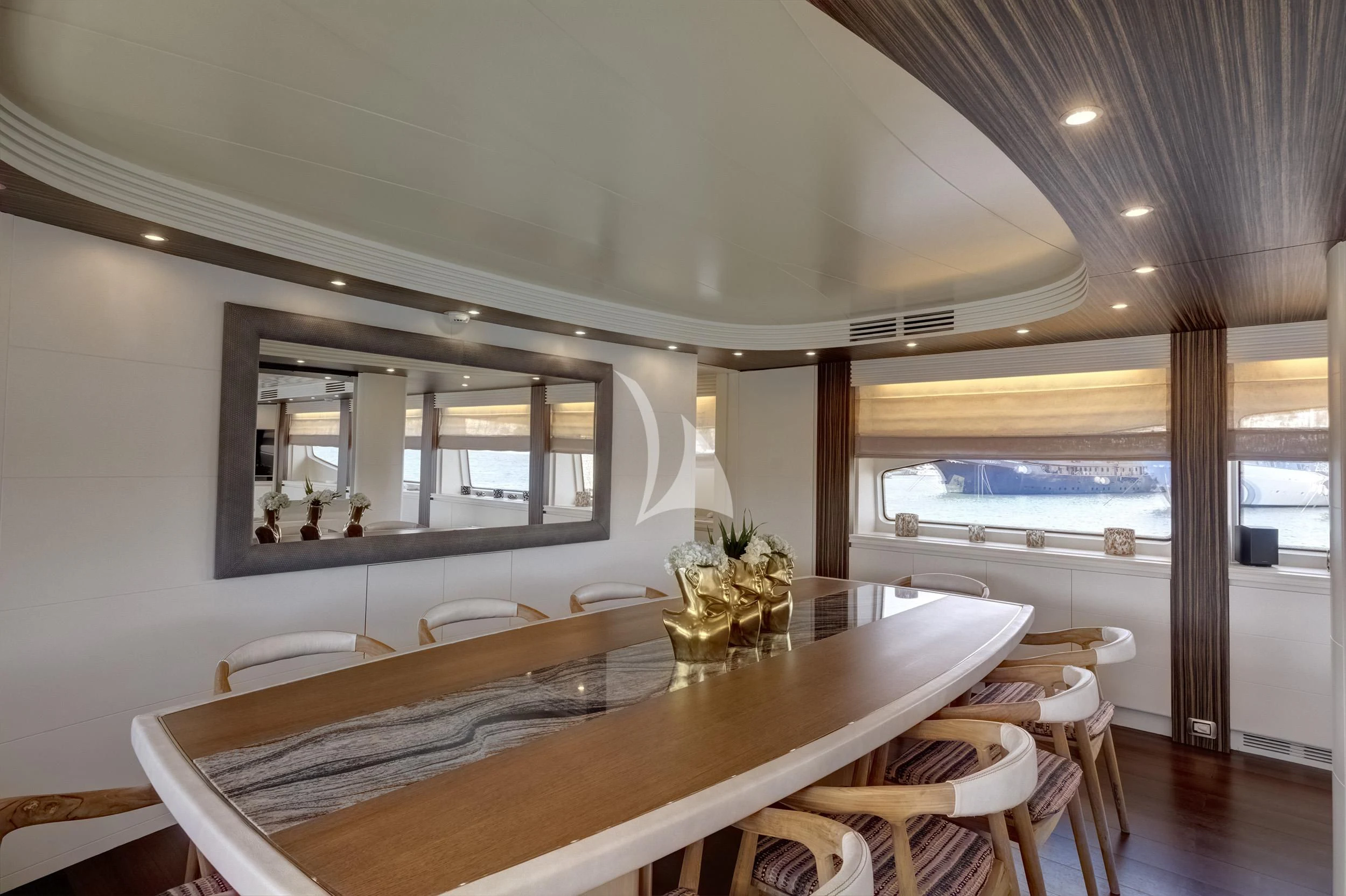 a dining table in a room aboard PAREAKI II Yacht for Sale