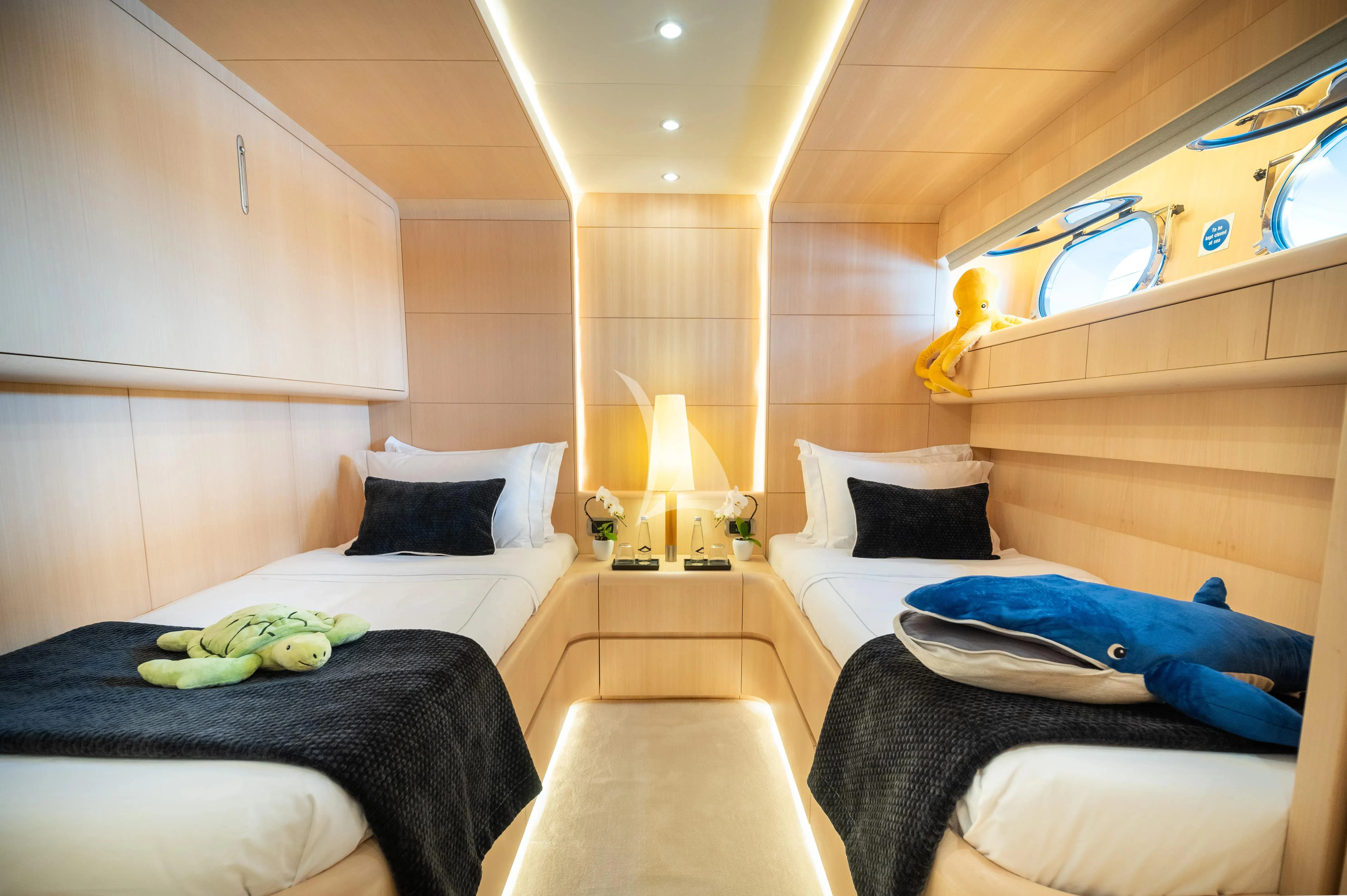 a room with a bed and a plush toy aboard PAREAKI II Yacht for Sale