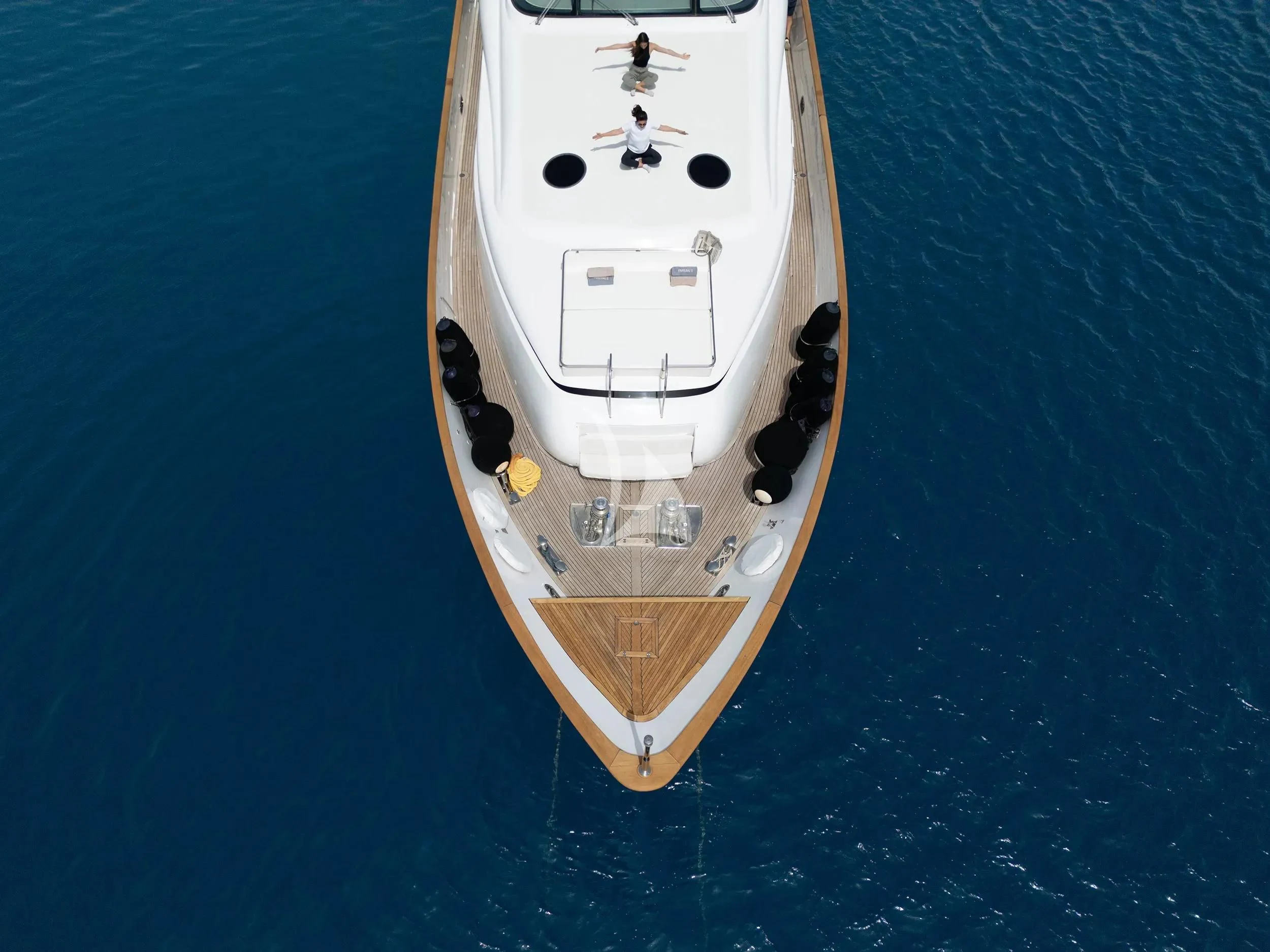 a white and black boat aboard PAREAKI II Yacht for Sale