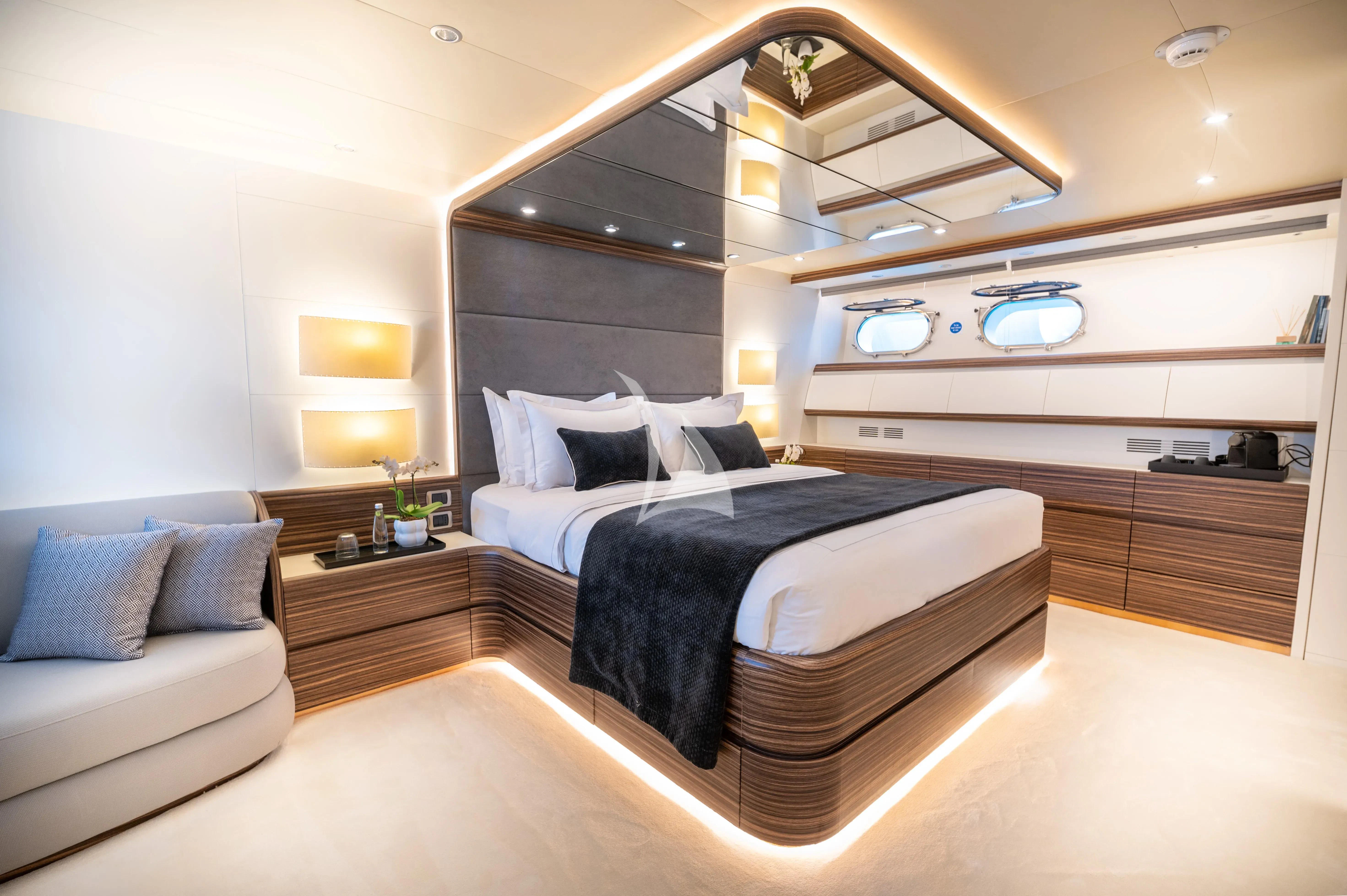 a large bedroom with a large bed aboard PAREAKI II Yacht for Sale