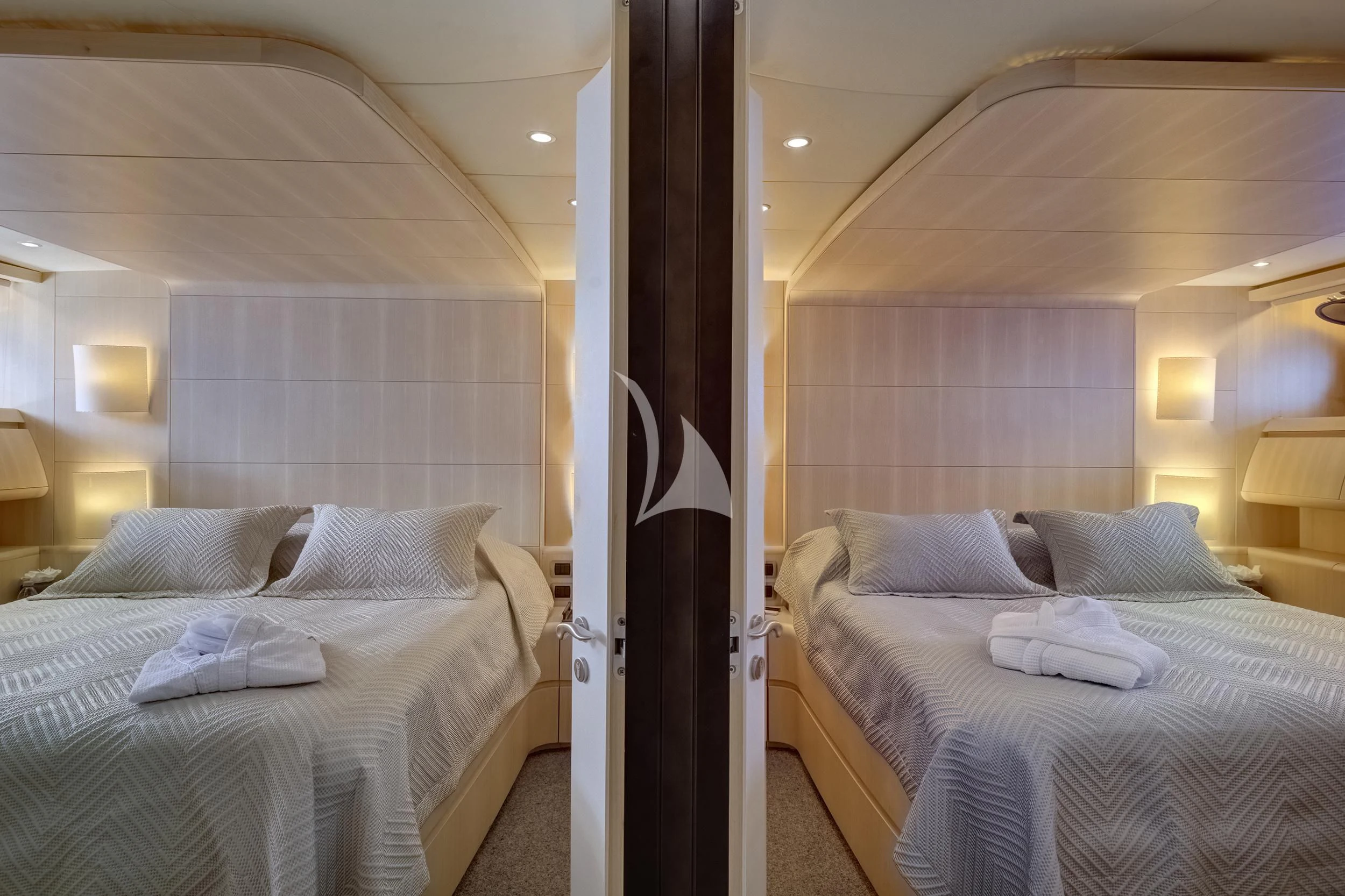 a room with two beds aboard PAREAKI II Yacht for Sale
