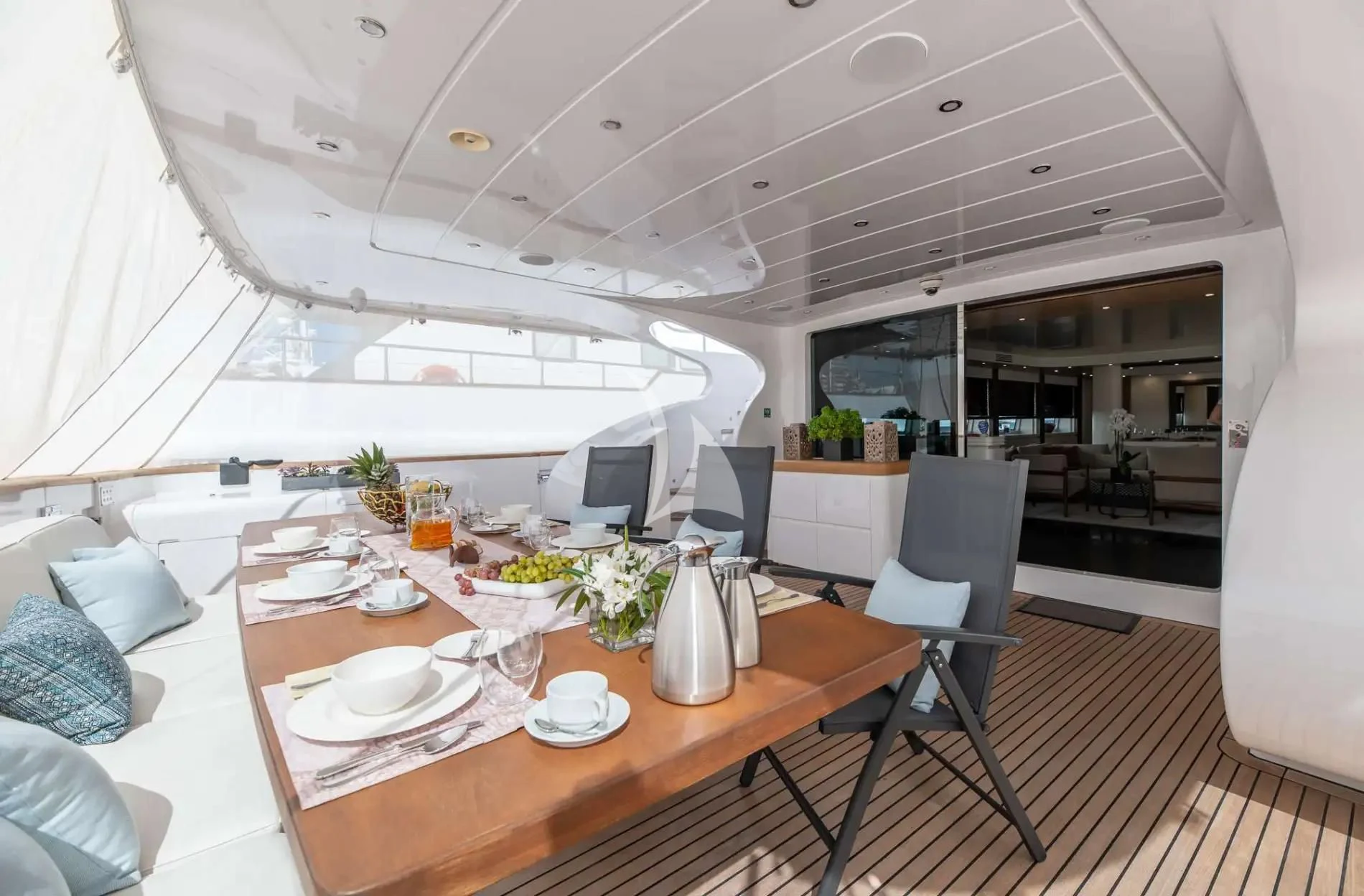 a large white tent with a table and chairs aboard PAREAKI II Yacht for Sale