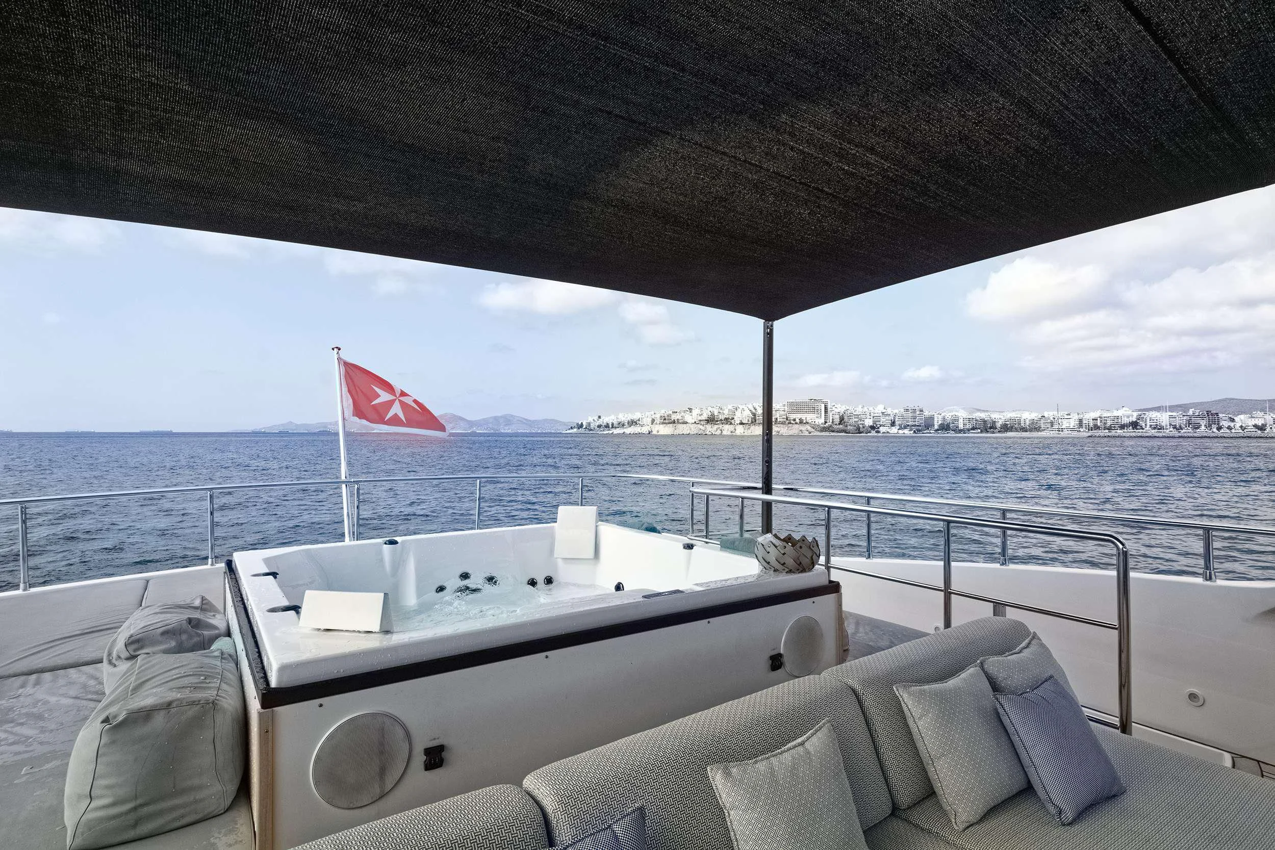 a boat with a flag on the front aboard PAREAKI II Yacht for Sale