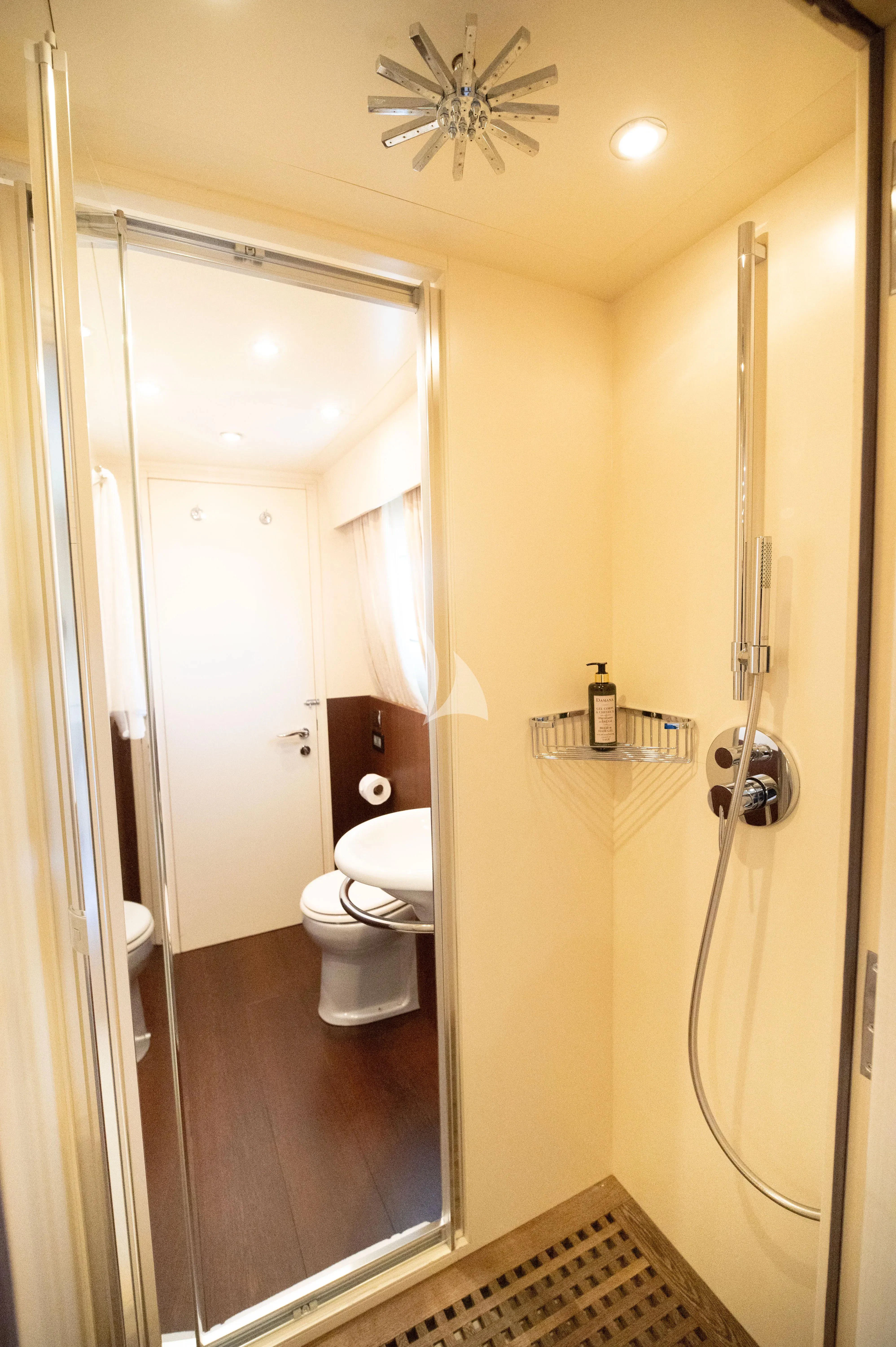 a bathroom with a ceiling fan aboard PAREAKI II Yacht for Sale