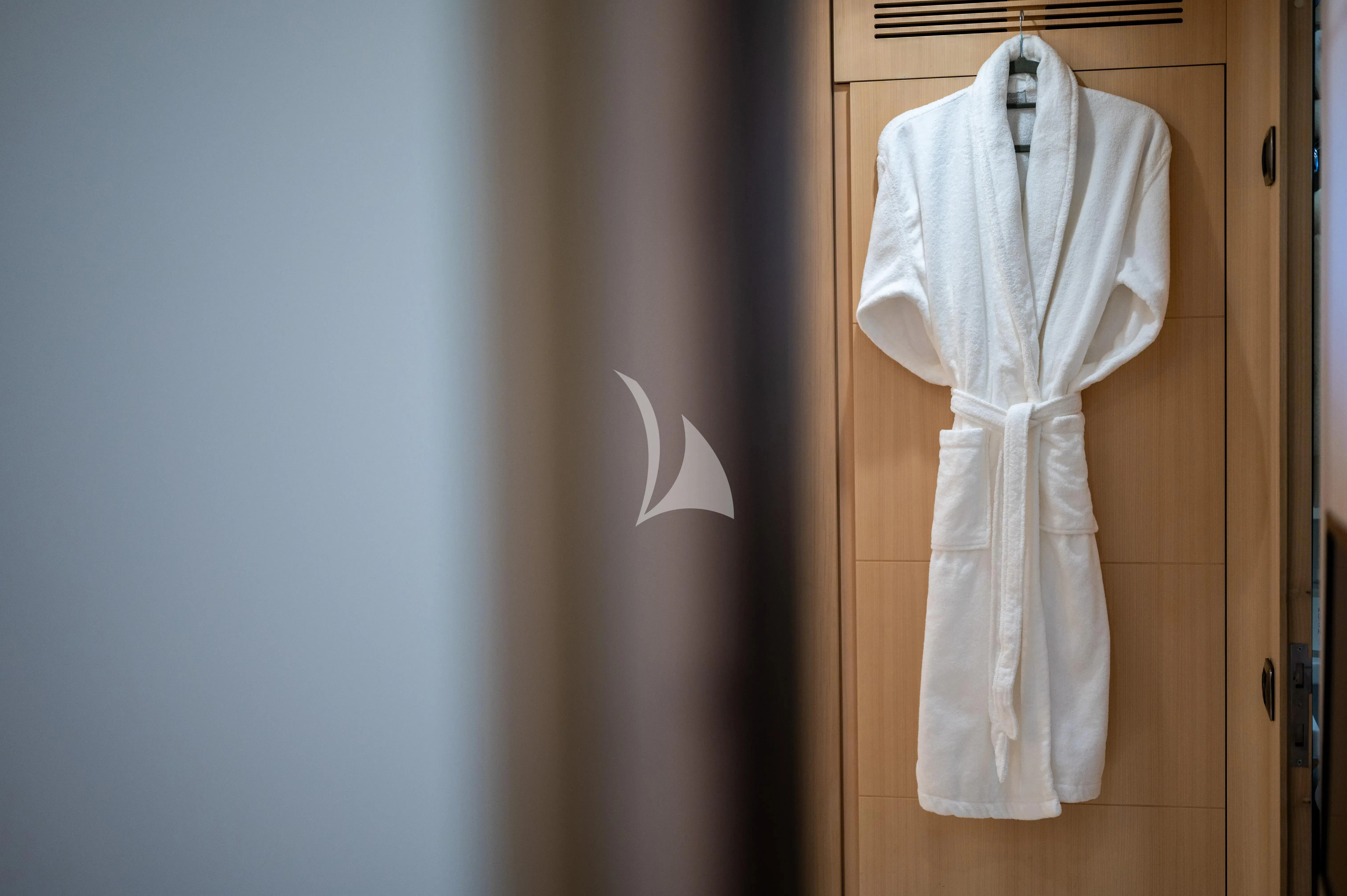 a white dress on a door aboard PAREAKI II Yacht for Sale