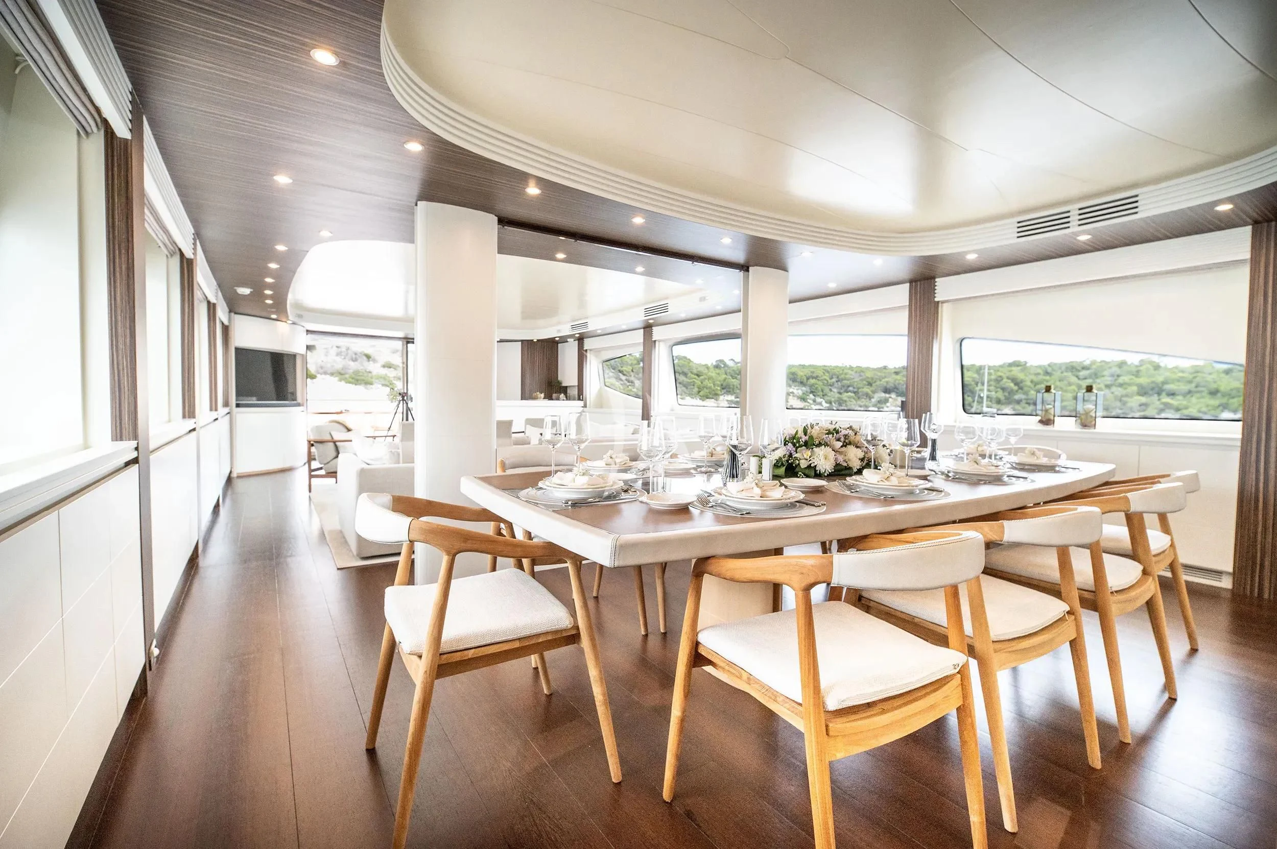 a dining table in a room aboard PAREAKI II Yacht for Sale