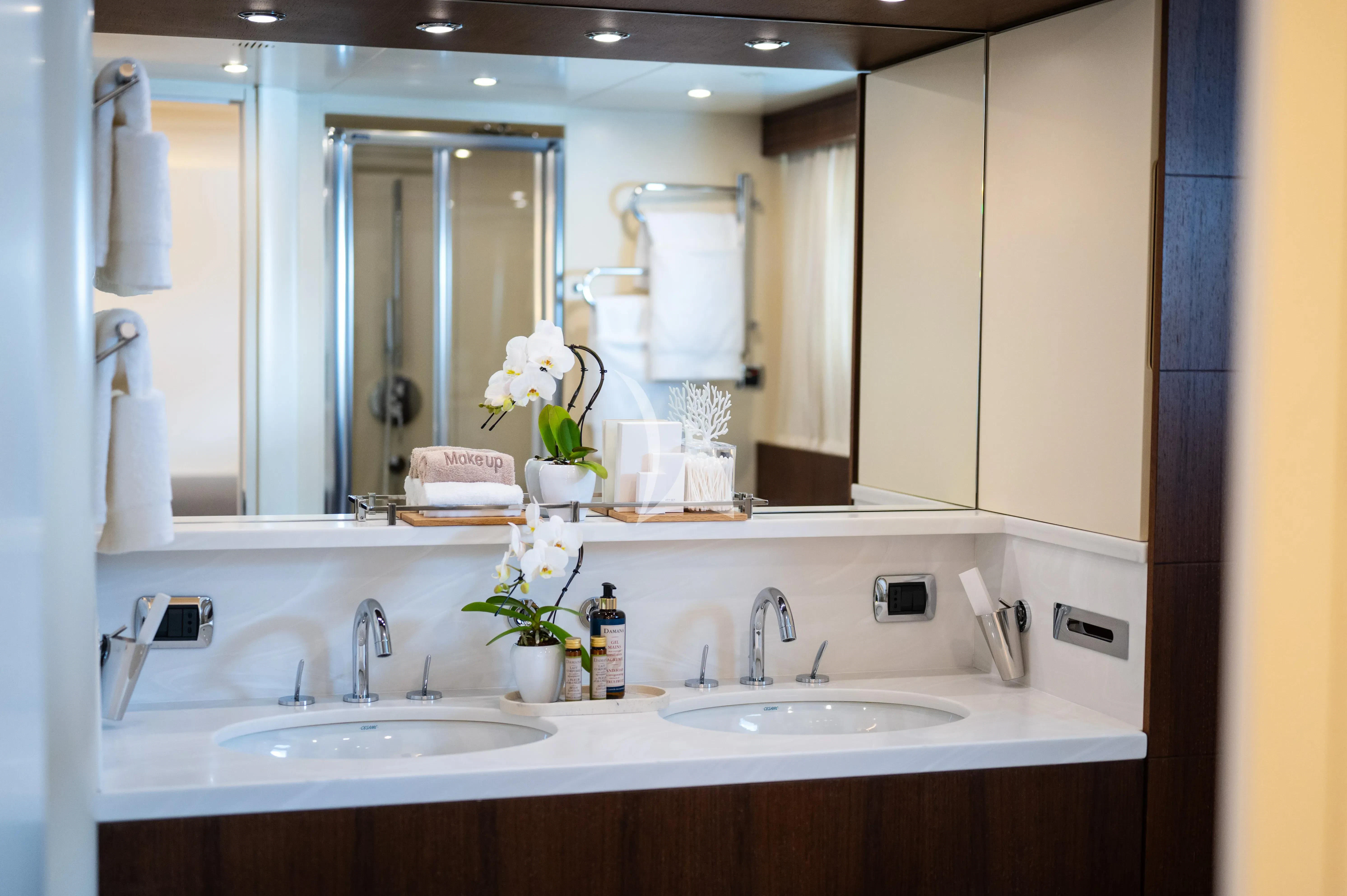 a bathroom with a large mirror aboard PAREAKI II Yacht for Sale