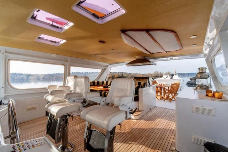 inside of a vehicle with chairs and tables aboard HER IDEA Yacht for Sale