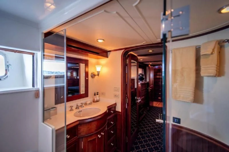 a bathroom with a sink and a mirror aboard HER IDEA Yacht for Sale