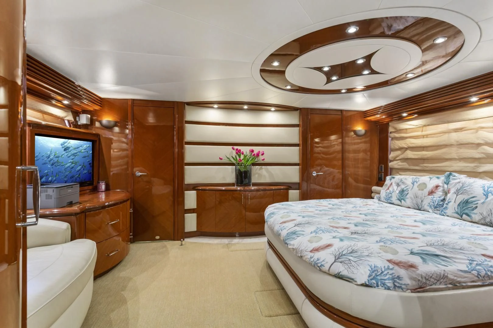 a bedroom with a bed and a tv aboard MONDRIAN Yacht for Sale