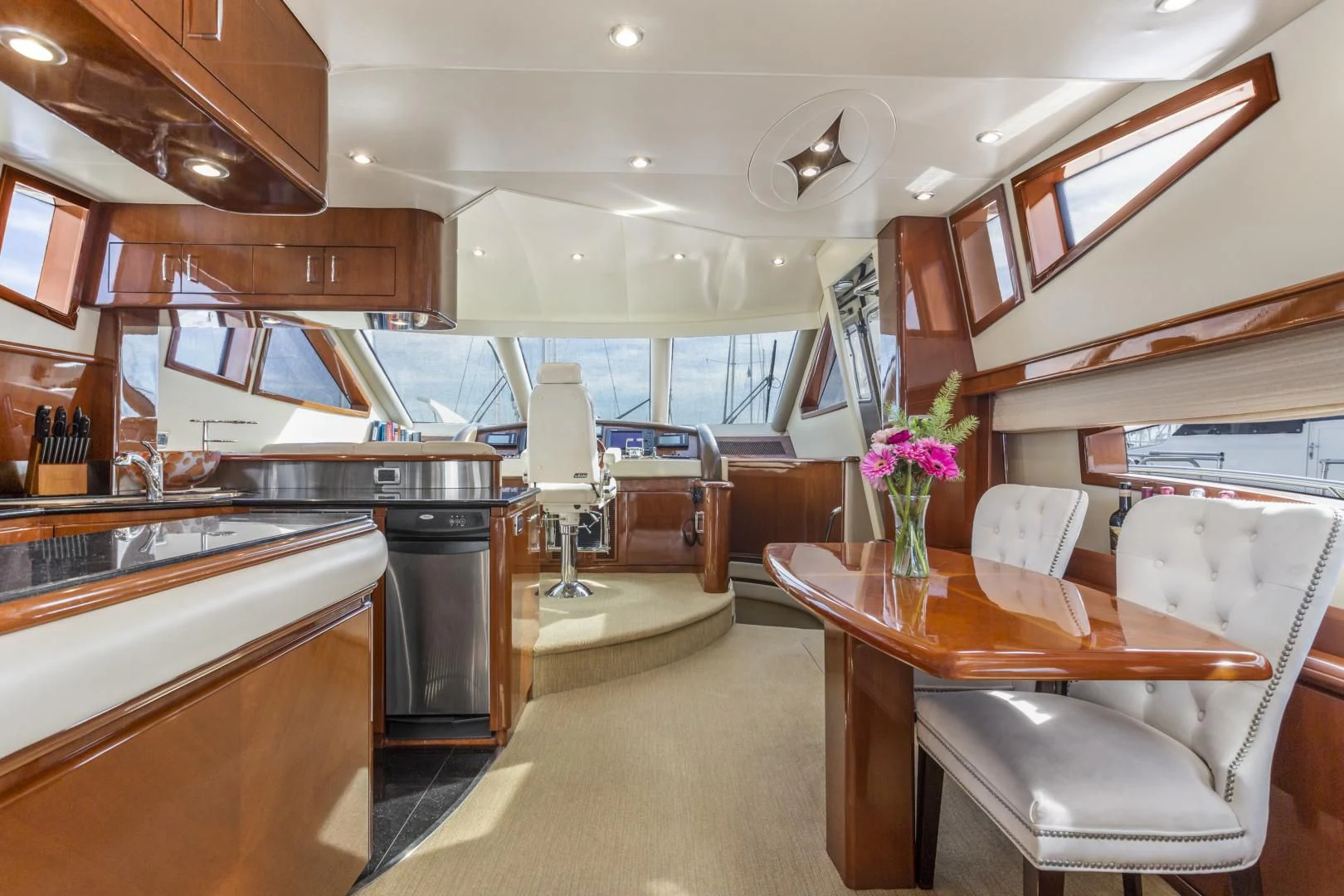 a kitchen and dining area aboard MONDRIAN Yacht for Sale