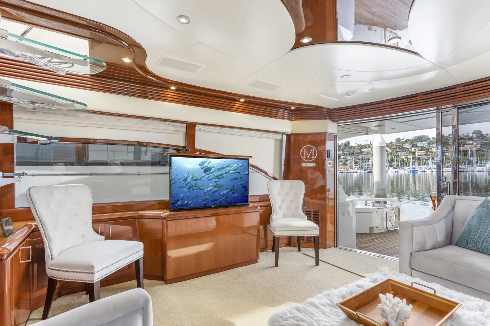 a room with a tv and chairs aboard MONDRIAN Yacht for Sale