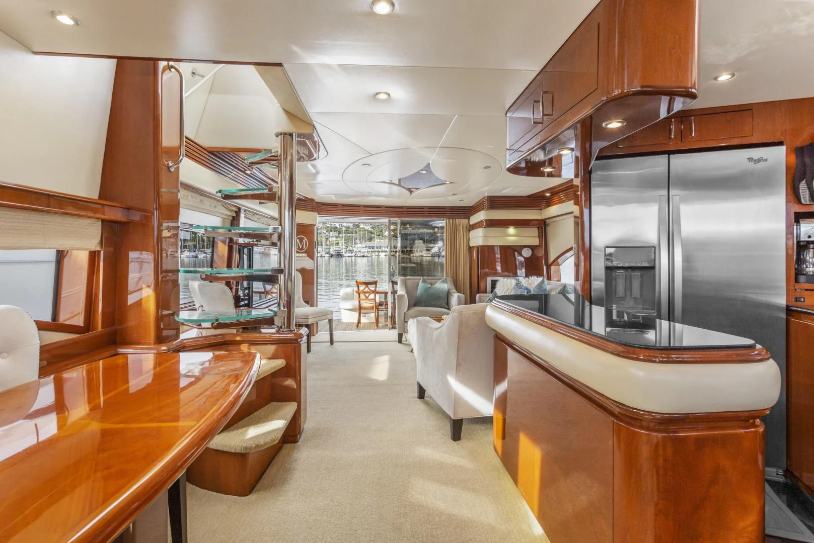 a room with a large refrigerator and a table aboard MONDRIAN Yacht for Sale