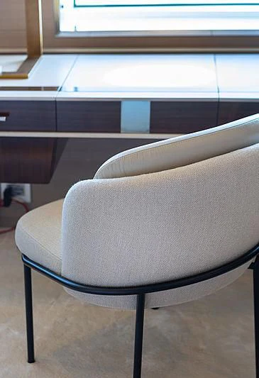 a white chair in a room aboard MONT-AL LAWZ Yacht for Sale