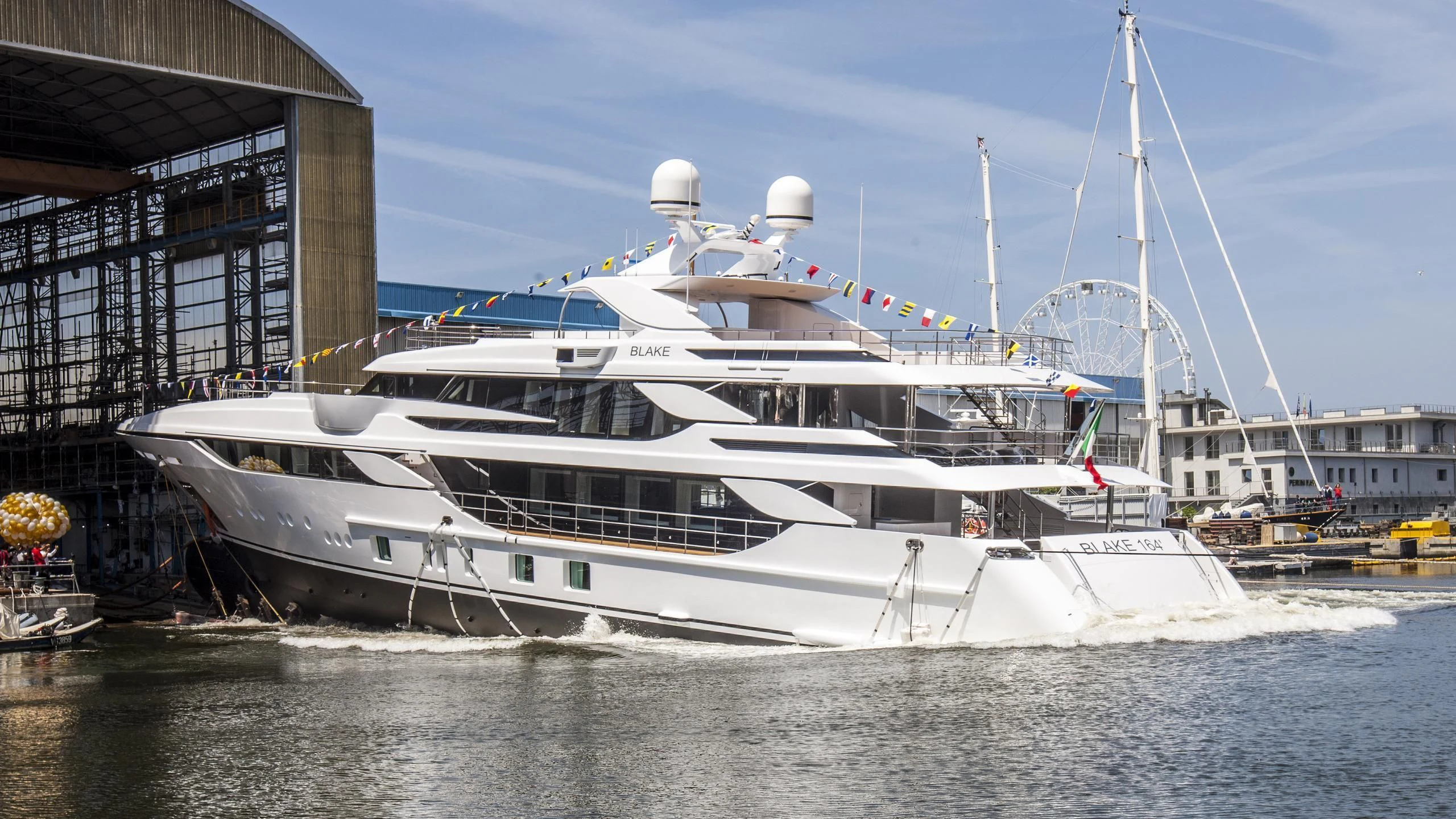 a white yacht in a harbor aboard MONT-AL LAWZ Yacht for Sale