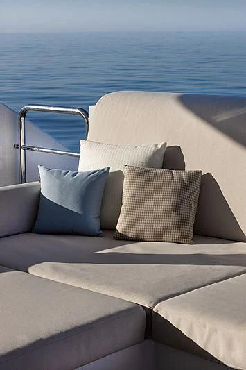 a couch with pillows on it aboard MONT-AL LAWZ Yacht for Sale