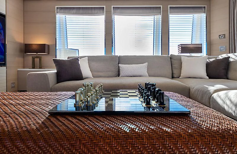 a living room with a couch and a table aboard MONT-AL LAWZ Yacht for Sale