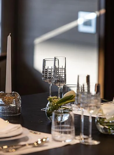 a table with glasses and a candle aboard MONT-AL LAWZ Yacht for Sale