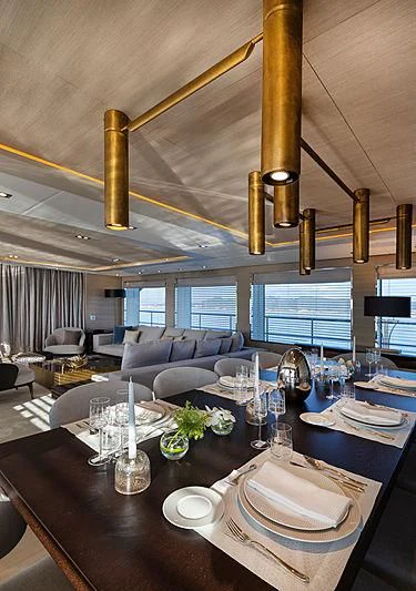 a large dining room with a large chandelier aboard MONT-AL LAWZ Yacht for Sale