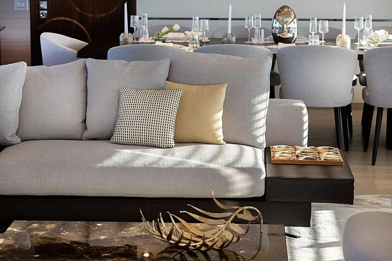 a couch with pillows and a table in the background aboard MONT-AL LAWZ Yacht for Sale