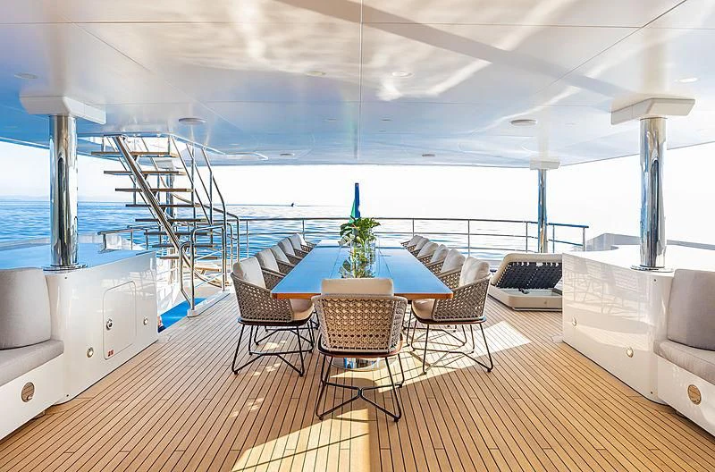a room with a table and chairs aboard MONT-AL LAWZ Yacht for Sale