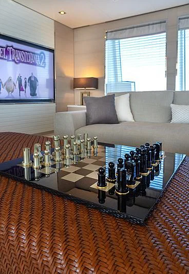 a living room with a table and couches aboard MONT-AL LAWZ Yacht for Sale