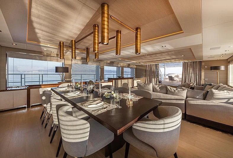 a large room with a table and chairs aboard MONT-AL LAWZ Yacht for Sale