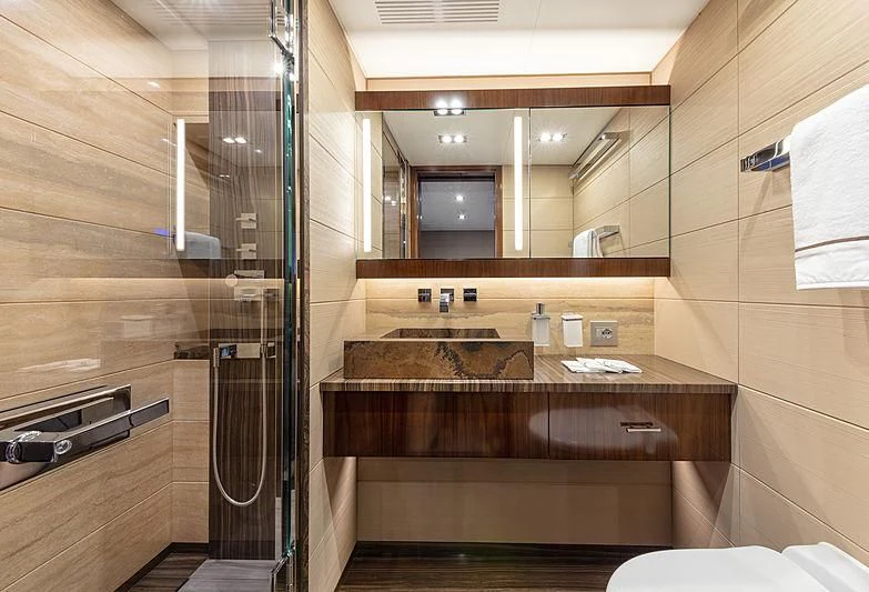 a bathroom with a glass shower aboard MONT-AL LAWZ Yacht for Sale