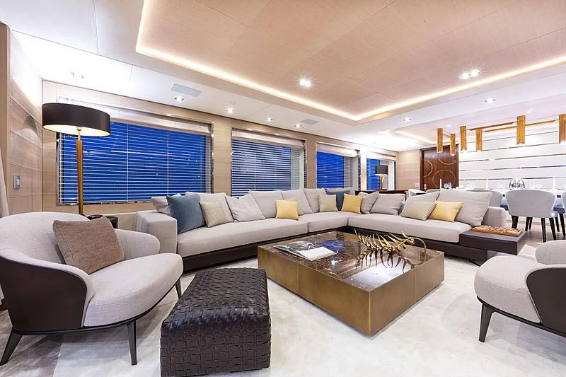 a living room with a large sofa and a coffee table aboard MONT-AL LAWZ Yacht for Sale