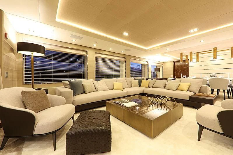 a living room with a couch and a coffee table aboard MONT-AL LAWZ Yacht for Sale