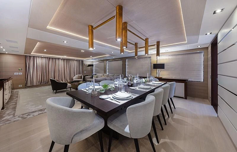 a large room with a table and chairs aboard MONT-AL LAWZ Yacht for Sale