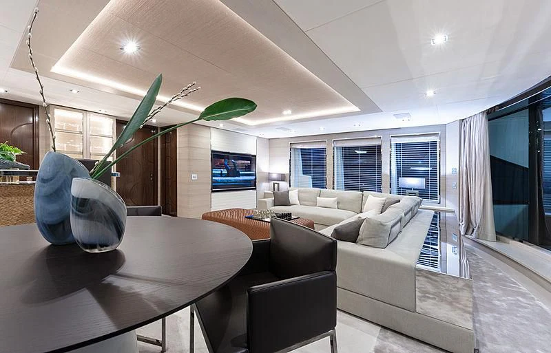 a room with a couch and a table with a tv on it aboard MONT-AL LAWZ Yacht for Sale