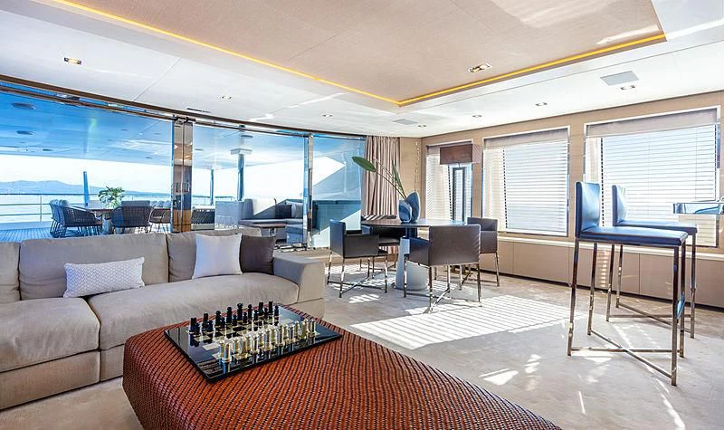 a living room with a couch and a table aboard MONT-AL LAWZ Yacht for Sale