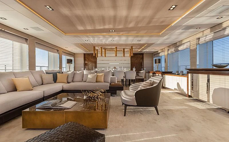 a living room with a couch and a coffee table aboard MONT-AL LAWZ Yacht for Sale