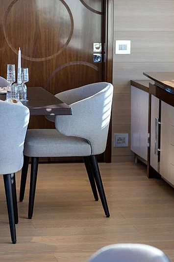 a table with chairs and a desk aboard MONT-AL LAWZ Yacht for Sale