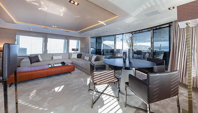 a large living room with a large table and chairs aboard MONT-AL LAWZ Yacht for Sale