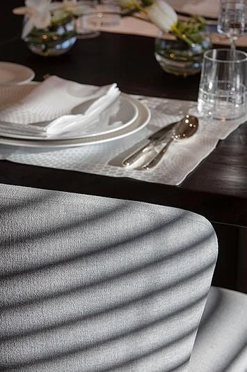 a table with a plate of food and silverware aboard MONT-AL LAWZ Yacht for Sale