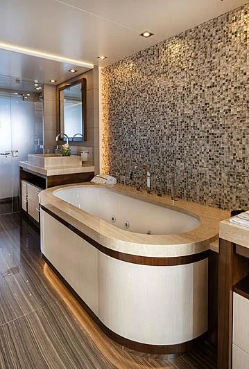 a bathroom with a large bathtub aboard MONT-AL LAWZ Yacht for Sale