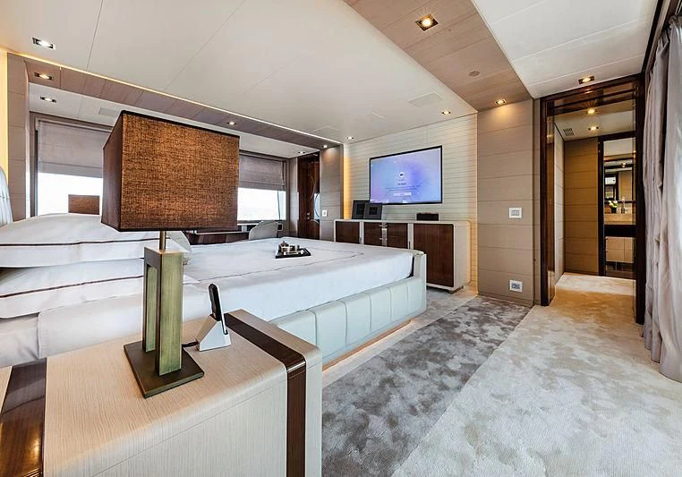 a room with a large bed and a television aboard MONT-AL LAWZ Yacht for Sale