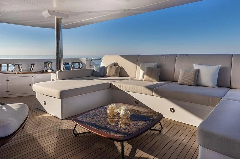 a living room with a couch and a table aboard MONT-AL LAWZ Yacht for Sale